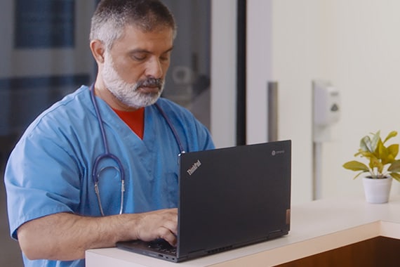Doctor using Chromebook in hospital