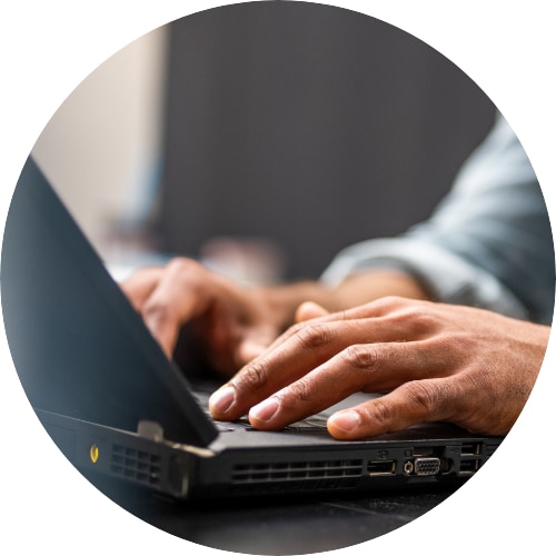 Man hands typing on laptop keyboard.