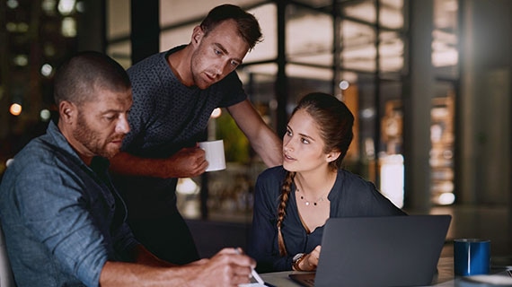 Person using laptop with glowing AI head icon and floating digital interface panels, symbolizing accelerated AI adoption with FastTrack, vector storage, and intelligent agents