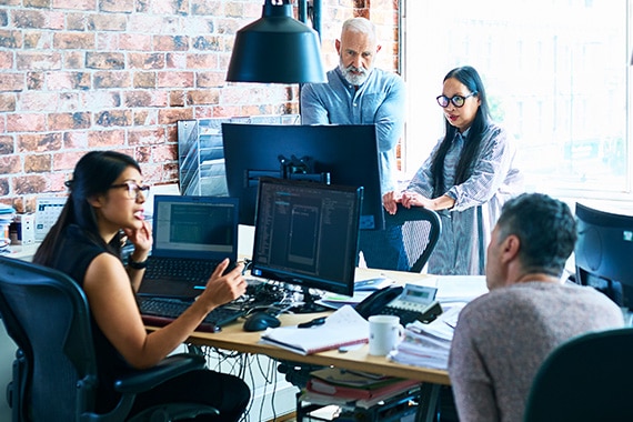 barracuda brand networks banner with people working in office