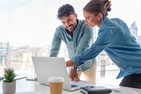barracuda brand networks banner with coworkers securely working on laptop