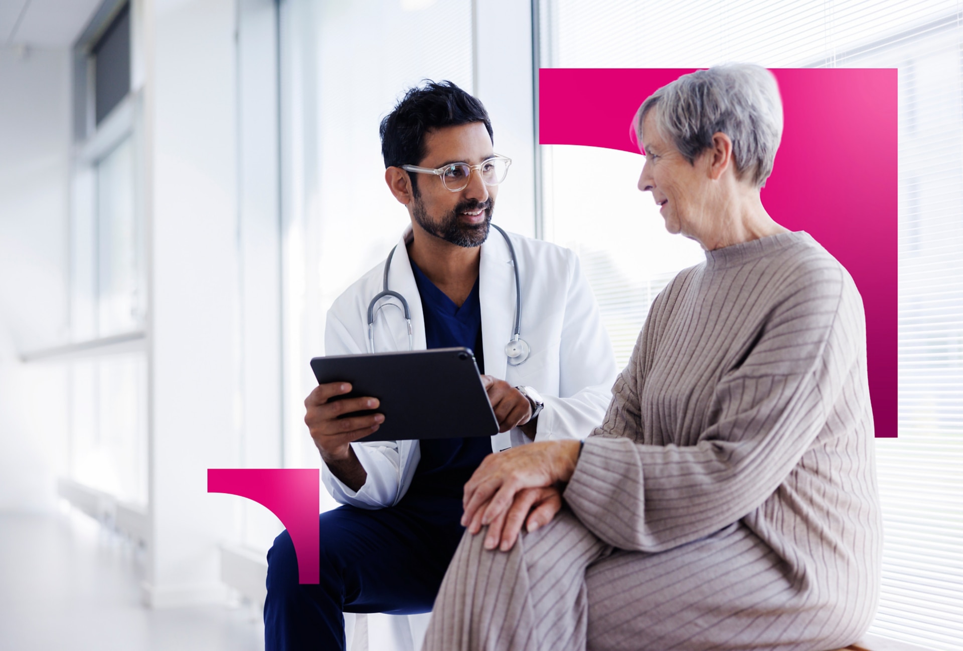Doctor consulting with an older patient using a digital tablet, highlighting healthcare network infrastructure and remote connectivity solutions.
