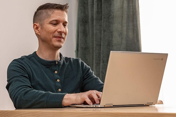 Person at home using Google Chrome laptop.