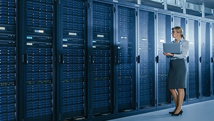 IT tech working in data center.