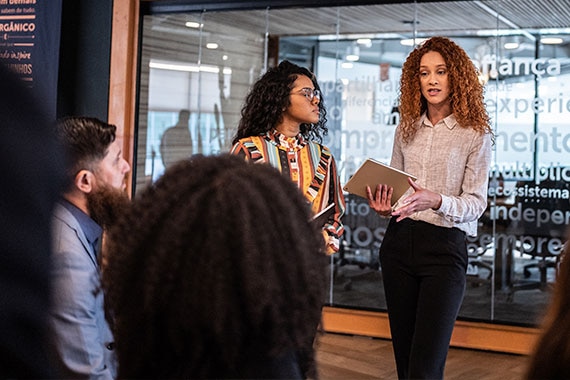 Two experienced IT instructors leading a professional training session, showcasing CDW’s global expertise in technology and cybersecurity solutions.