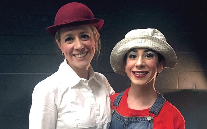 Tara Barbieri and her daughter smiling before a dance show