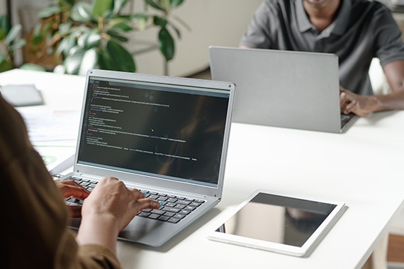 Person using secure firewall on laptop