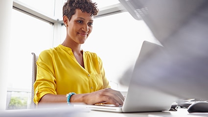 woman working in front of a computer in an office