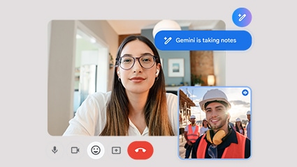 employees collaborating in front of a computer in an office setting