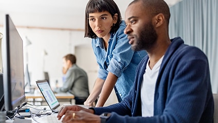 image of laptop computers on a desk