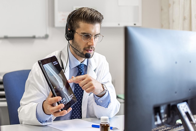 Doctor with computer.