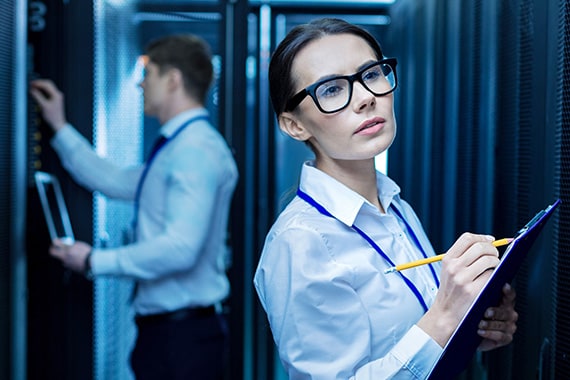 Intel coworkers working together in server room to ensure data security