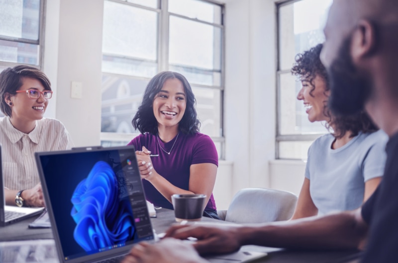 Coworkers collaborating in a bright office.