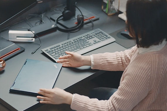 Woman at home working on Chromebook laptop