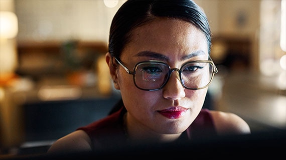 Cybersecurity professional analyzing threats with CrowdStrike Falcon and Mimecast Incydr for real-time threat detection and insider risk management