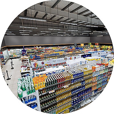 Aisles and shelves in supermarket, wide angle view.