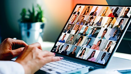 Image of worker on a video conference call.