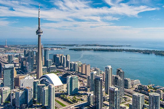 cityscape of toronto quebec canada with cn tower along the water in the day