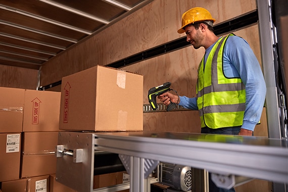 Person in truck using zebra scanner.