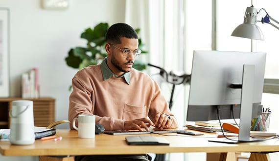 zscaler showcase image of employee working from a home office.