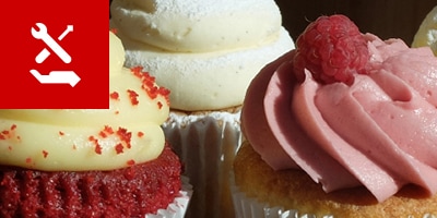 close up of cupcakes on shelf