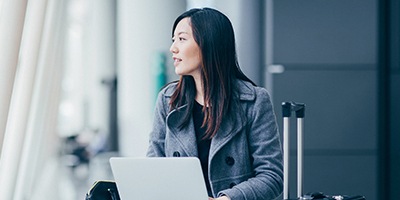 Two business people working on laptop