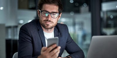 Businessman looking at smartphone 