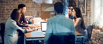  Gropup of professionals meeting around a table