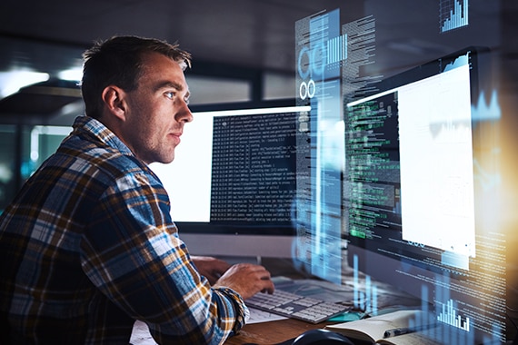 thumbnail image of a man using AI to assist with workflow on a desktop computer