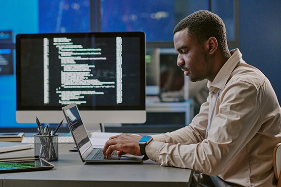 thumbnail image of an IT specialist working on security settings on a laptop computer