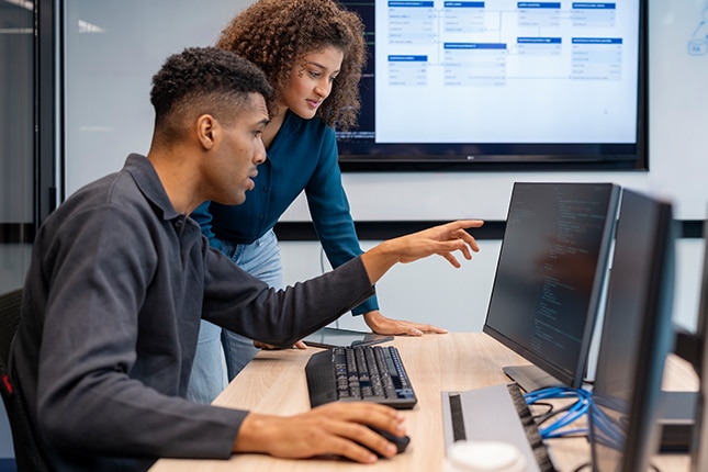 Software programmers working with AI technology.