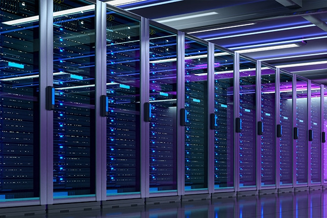 Dark server room with neon lights highlighting the servers.