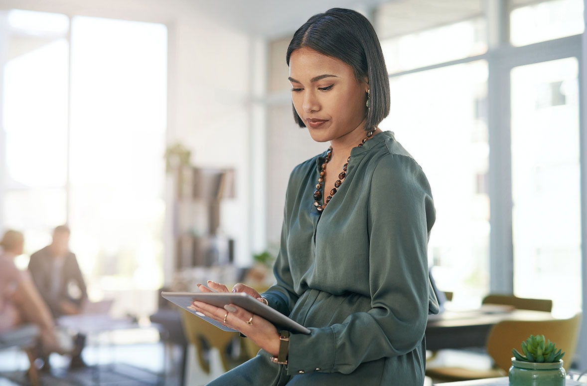 a young businesswoman using a digital tablet in a modern office