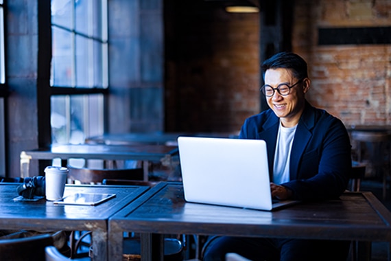 thumbnail card image of a man working on a laptop computer