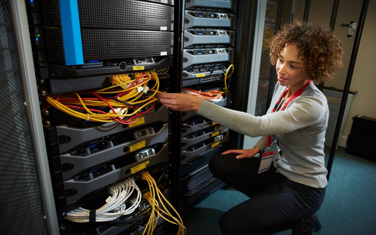 Lady sitting in front of data server