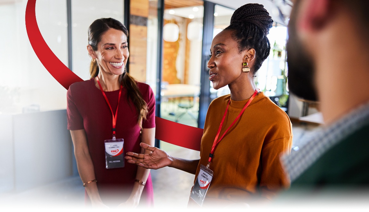 hero image of coworkers talking in an office environment