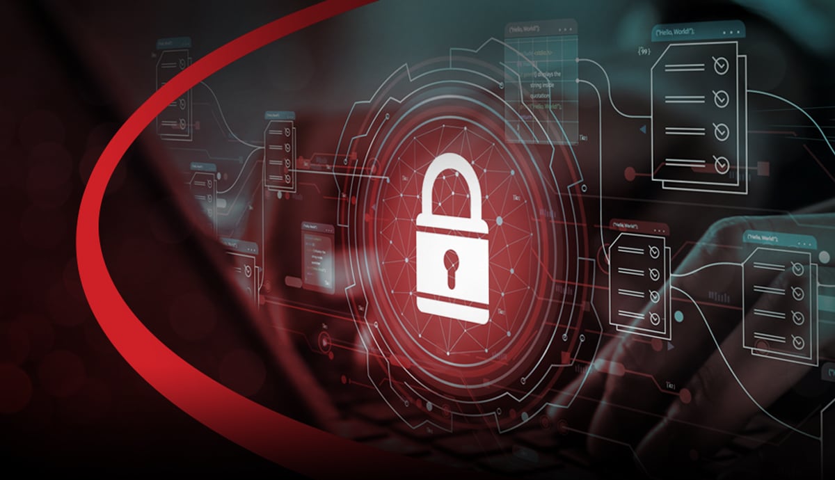 Cybersecurity banner image of an employee typing on a keyboard with a lock icon emerging on the screen.