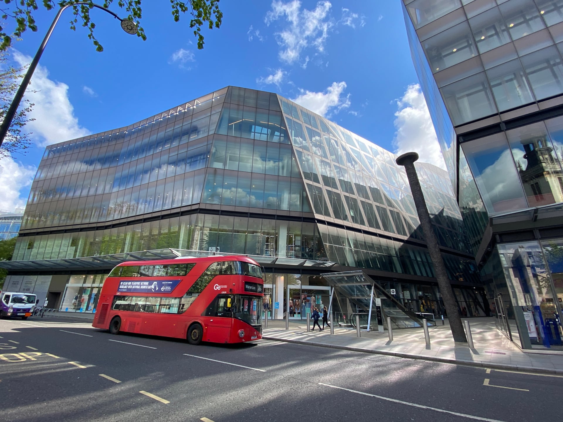 External view of CDW UK’s London office. A double-decker bust sit in front of building’s glass façade.