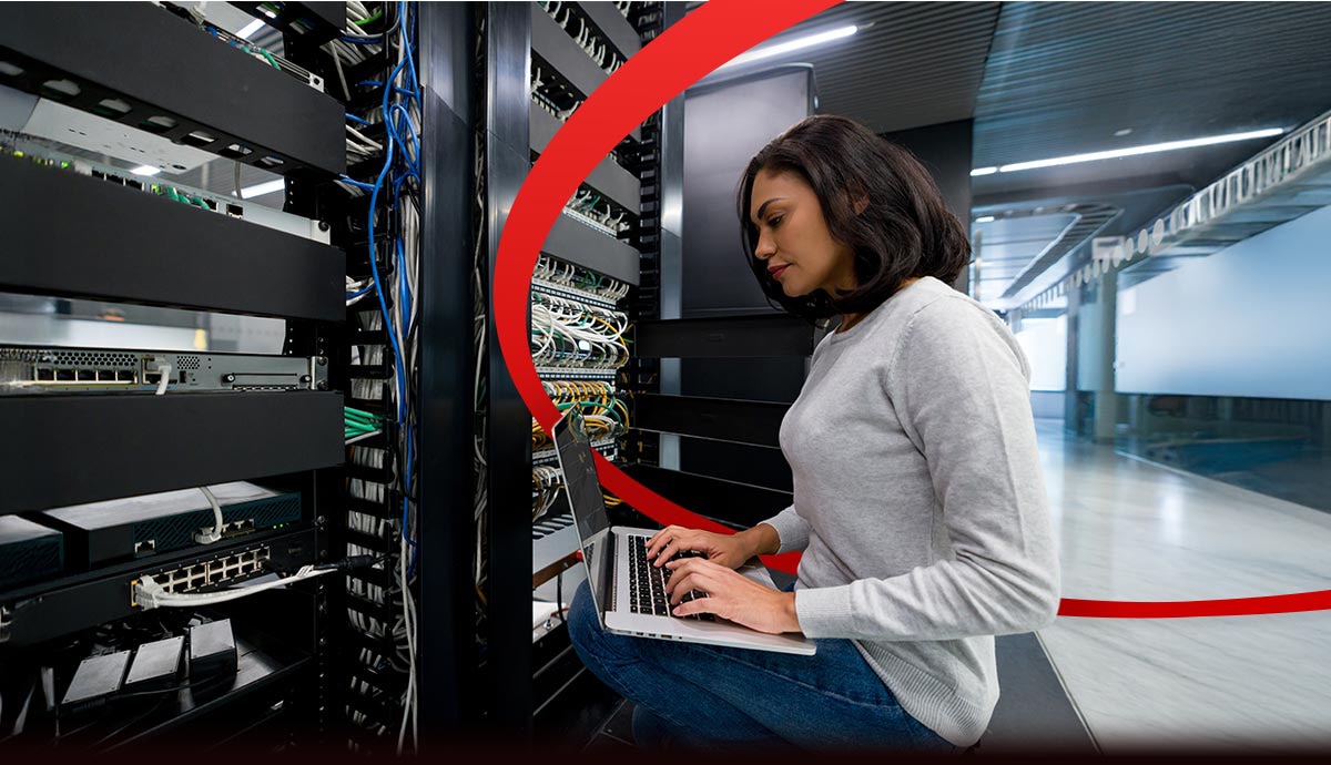 IT professional managing hybrid cloud infrastructure in a secure data center, enabling scalability, innovation, and seamless multicloud integration.