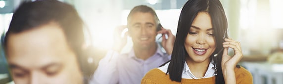 Employees answering phones in a call center