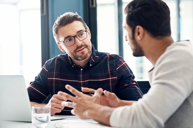 Shot of two businessmen having a discussion in an office