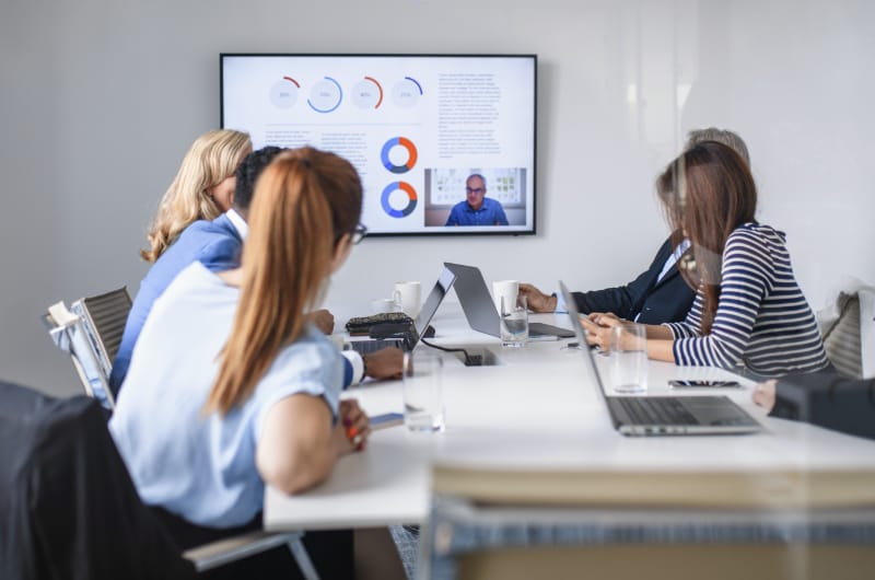 A team is having a video conference in an office space.