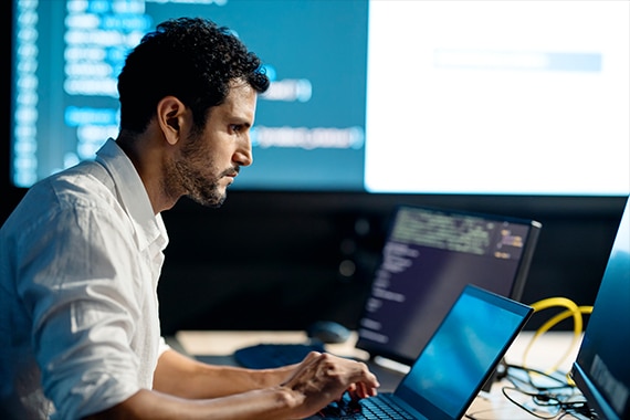 thumbnail image of an IT specialist working on a laptop