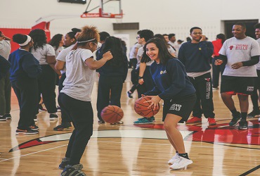 Students dribble basketball at CDW Tech Fore! kickoff