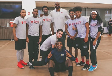Horace Grant poses with Chicago Bulls College Prep students