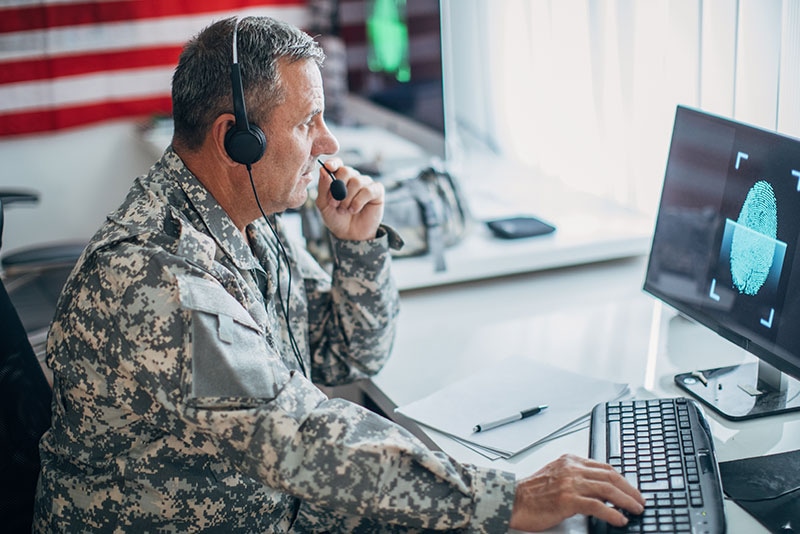Military personnel using Dell Government IT edge computing solution with AI and high-speed infrastructure, showcasing Dell and NVIDIA-powered mission-critical capabilities at the edge