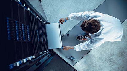 thumbnail image of an IT Technician working on a Dell storage server