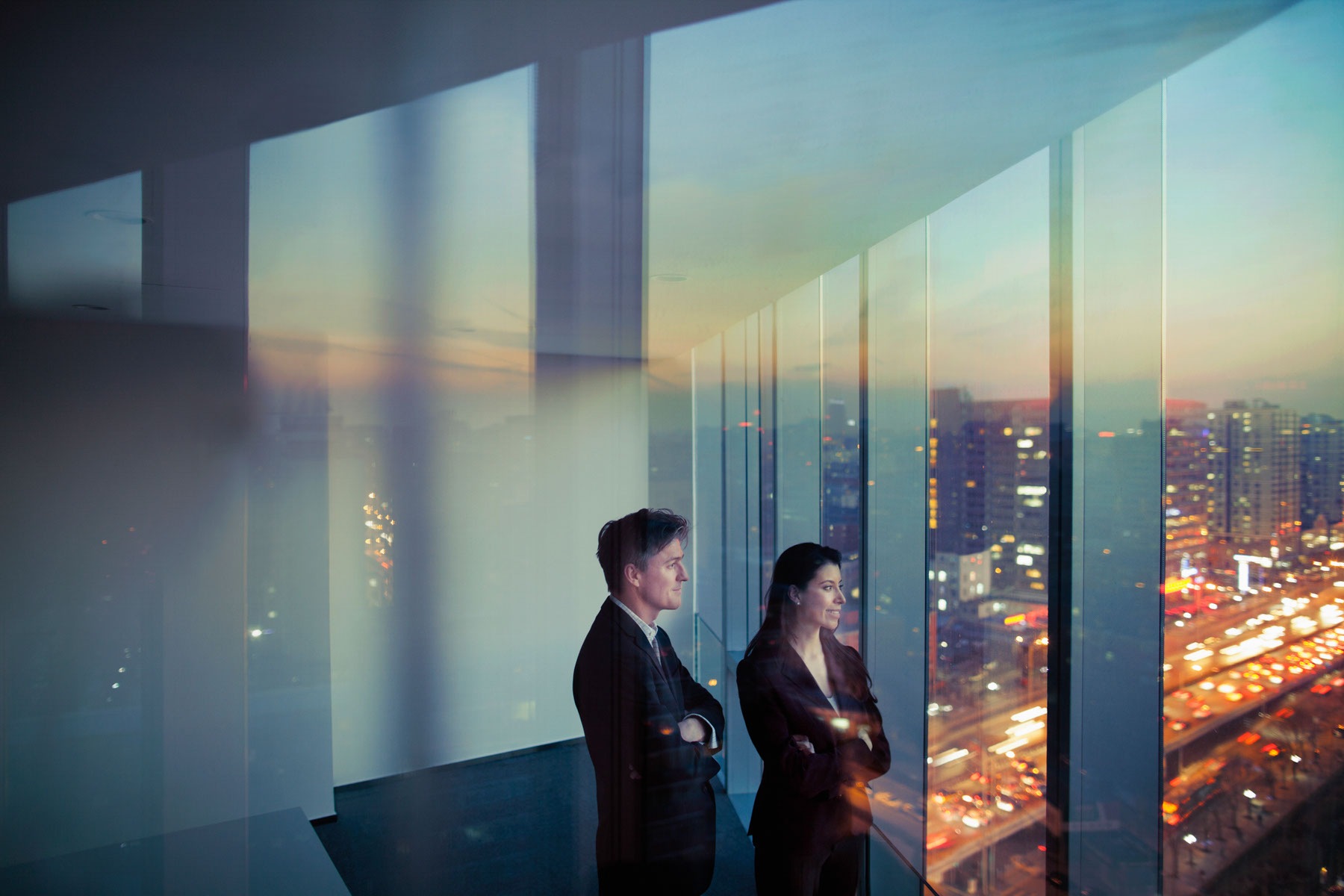 Adult Hispanic woman Caucasian man CEO executive team businessman businesswoman business people in conference meeting room in contemporary modern office daylight sunset dusk talking planning thinking strategy well dressed suit diversity multi-ethnic problems solutions unity cityscape downtown urban new beginnings breaking new ground decisions choices the way forward contemplation vision focus choices decisions solitude quiet alone