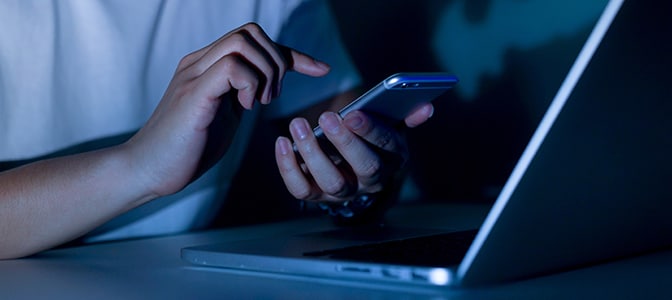 close up image of a young man hand holding smartphone 