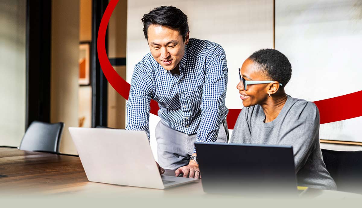 Professionals collaborating on laptops to create seamless, data‑driven digital experiences across web, mobile and customer touchpoints.